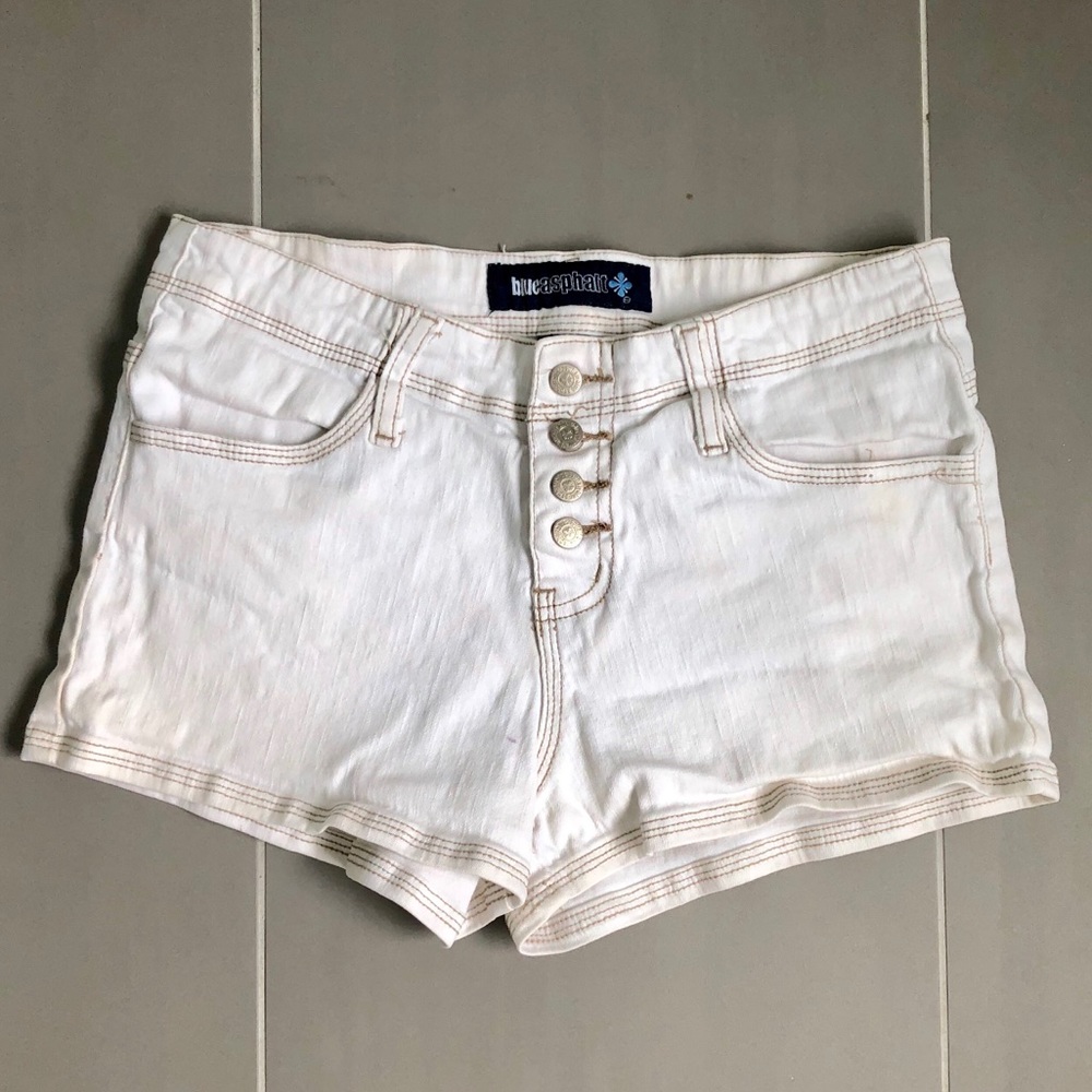 White denim shorts with tan stitching